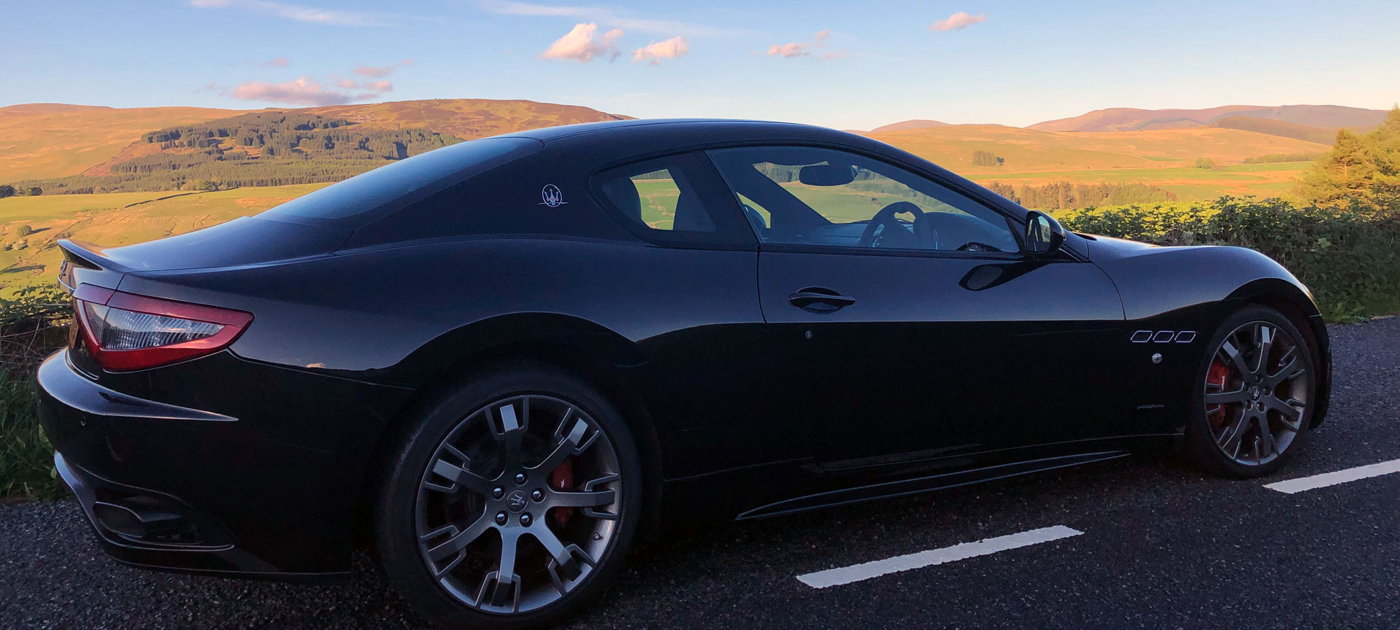 Maserati parked in the countryside